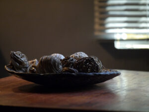 Moody image of a table decor of a plate and balls. Photo by Nanaresh-2024